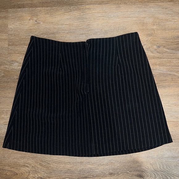 Black with white pin stripe skirt, never fit me.I’m selling it for$15 Super cute - Picture 2 of 3